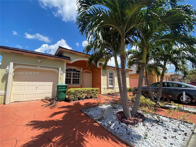 view of front of home with a garage