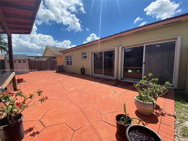 view of patio / terrace featuring a storage shed and central air condition unit