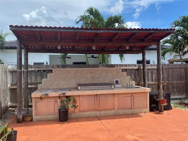 view of patio with sink, grilling area, and area for grilling