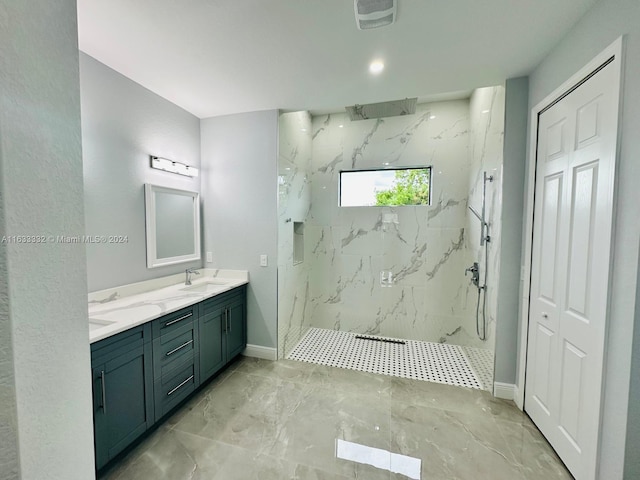 bathroom with tiled shower and vanity