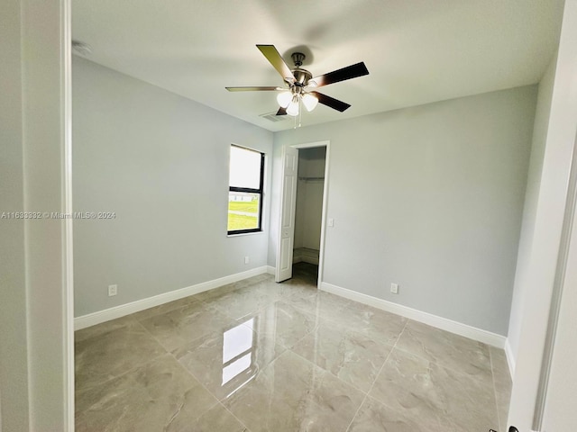 spare room featuring ceiling fan