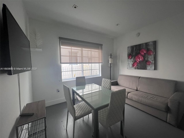 dining room with baseboards