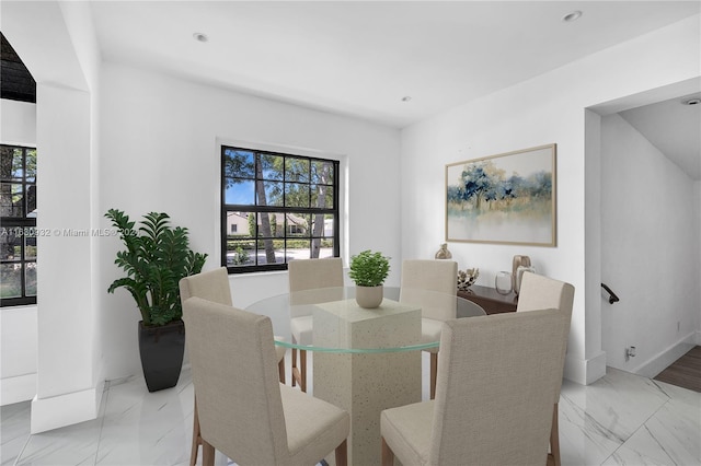 dining area with light tile patterned floors