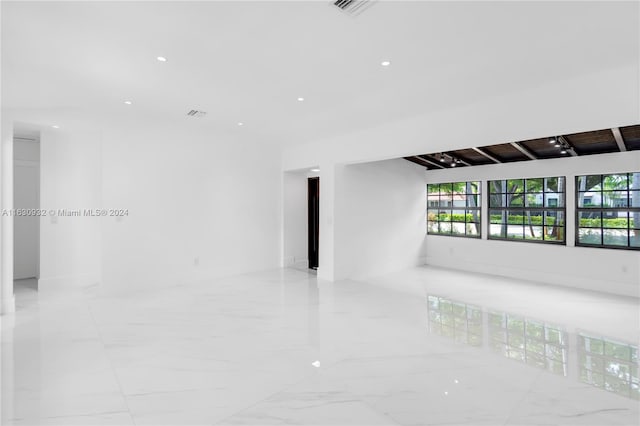 spare room featuring light tile patterned floors