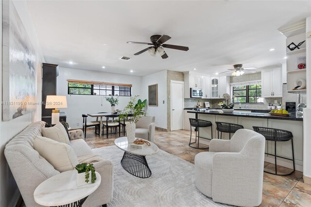 living room featuring ceiling fan