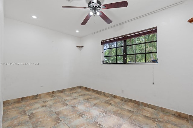 unfurnished room featuring ceiling fan