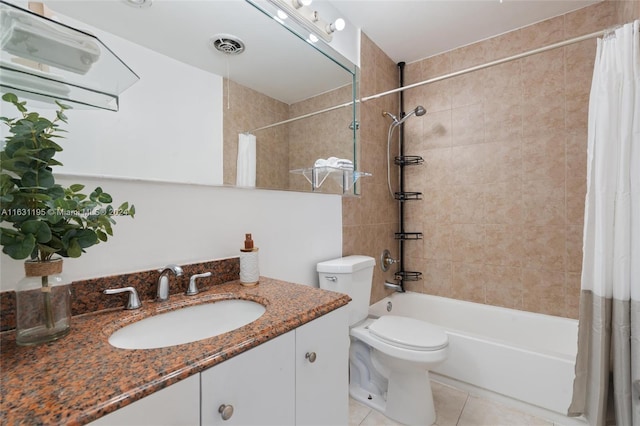 full bathroom featuring vanity, toilet, tile patterned floors, and shower / bath combo