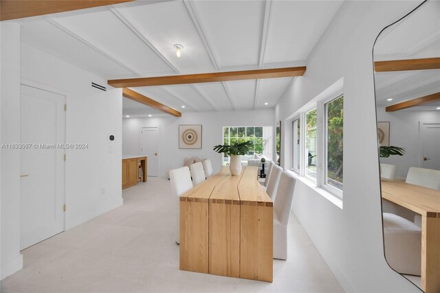 dining room with beamed ceiling