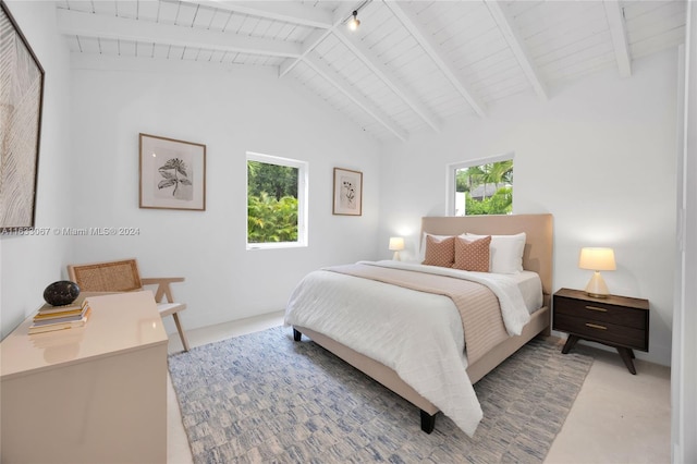 bedroom featuring wooden ceiling, multiple windows, beamed ceiling, and rail lighting