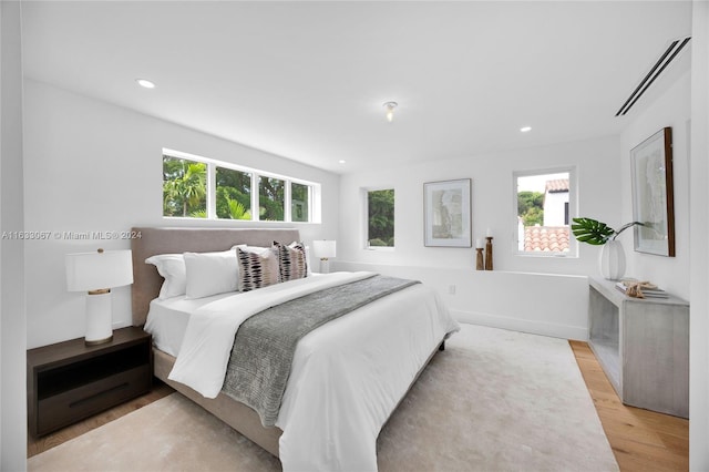 bedroom with light wood-type flooring