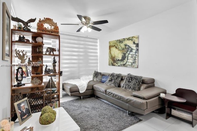 tiled living room featuring ceiling fan