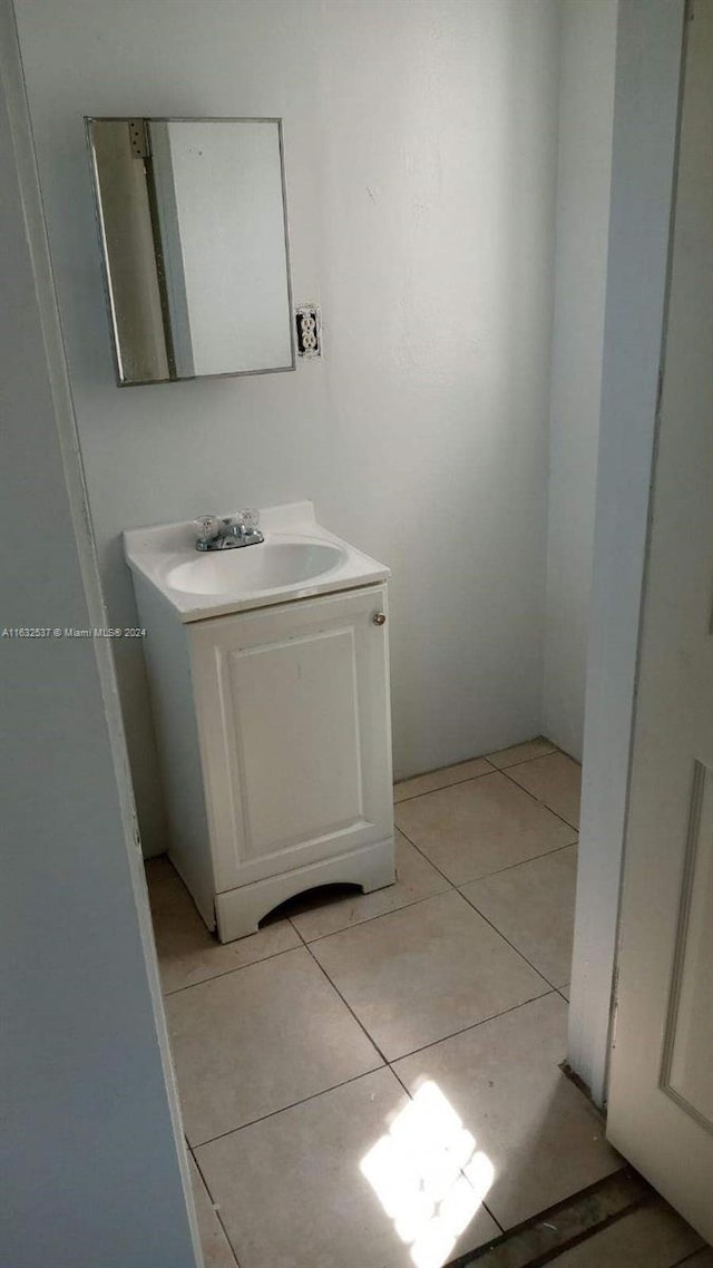 bathroom featuring tile patterned flooring and vanity