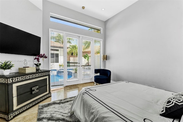 bedroom with access to exterior and french doors