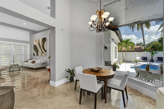 dining area featuring a notable chandelier