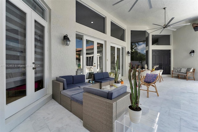 view of patio with an outdoor living space, ceiling fan, and french doors