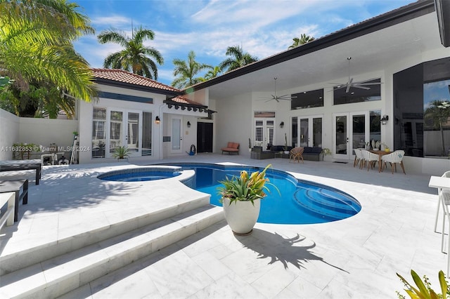 view of swimming pool featuring a patio, french doors, ceiling fan, and an in ground hot tub