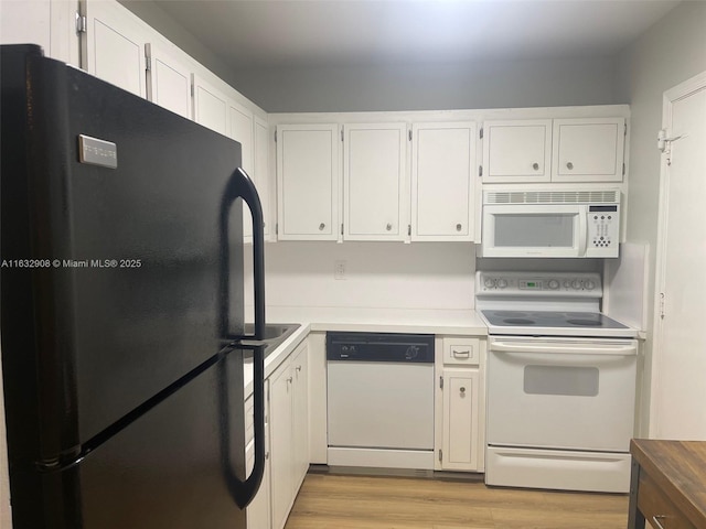 kitchen with white cabinets, white appliances, and light wood-type flooring