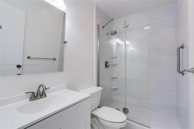 bathroom featuring walk in shower, vanity, and toilet