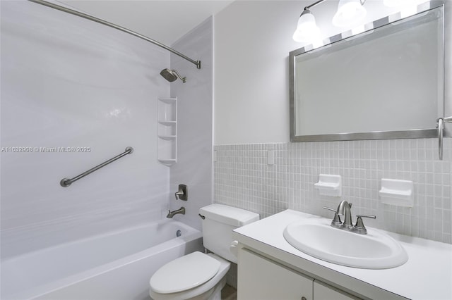 full bathroom with vanity, shower / bathtub combination, toilet, and tile walls