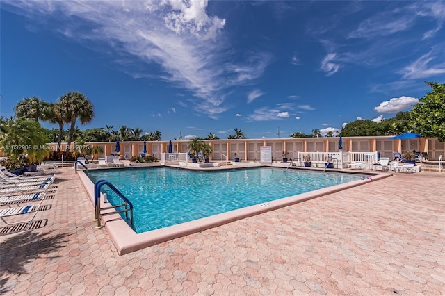 view of swimming pool with a patio