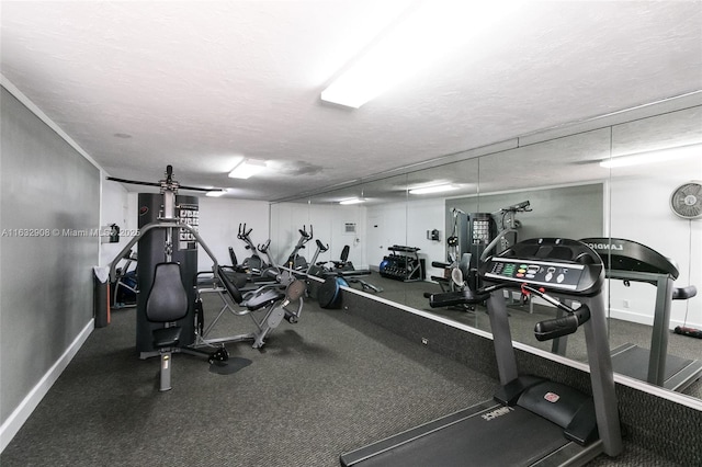 gym featuring a textured ceiling