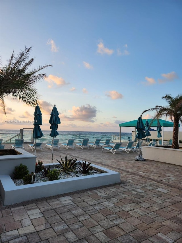 view of patio terrace at dusk