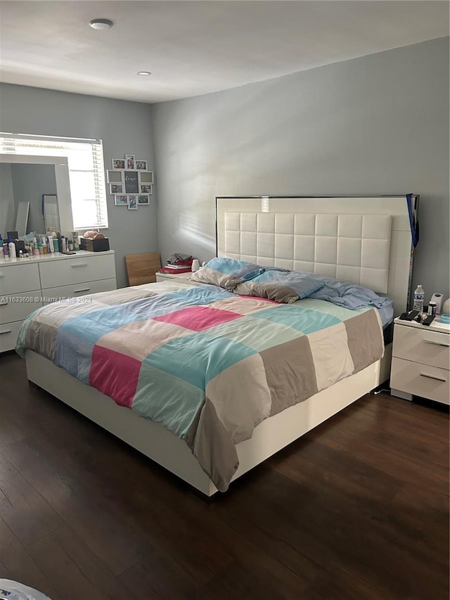 bedroom featuring dark hardwood / wood-style flooring