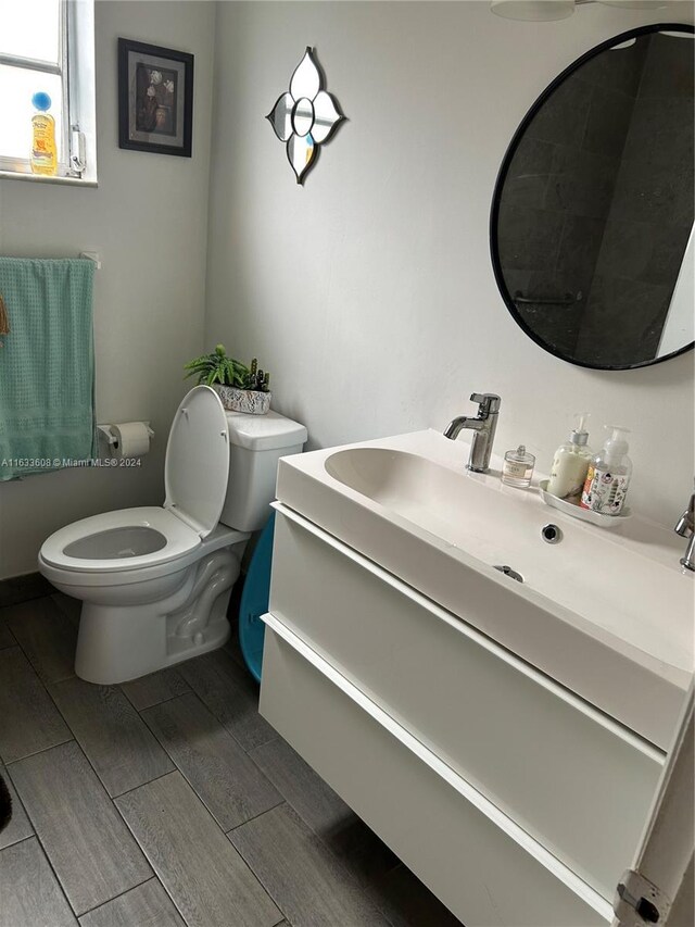 bathroom featuring toilet and vanity