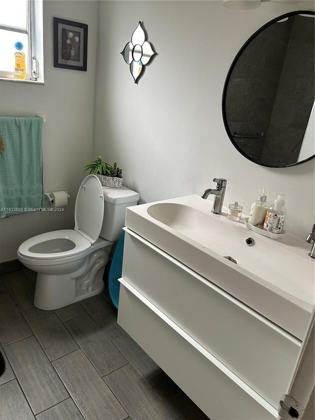 bathroom featuring vanity and toilet