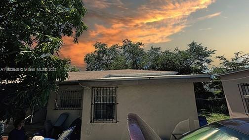 view of property exterior at dusk