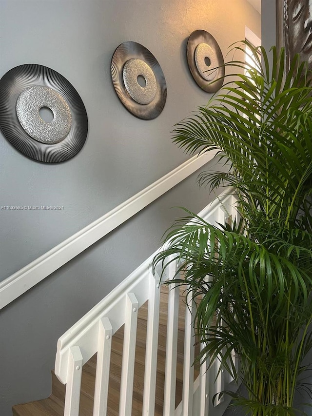 stairway featuring hardwood / wood-style floors