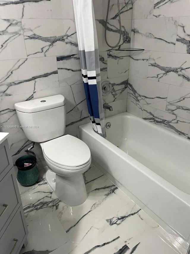 full bathroom featuring toilet, shower / tub combo, vanity, and tile walls