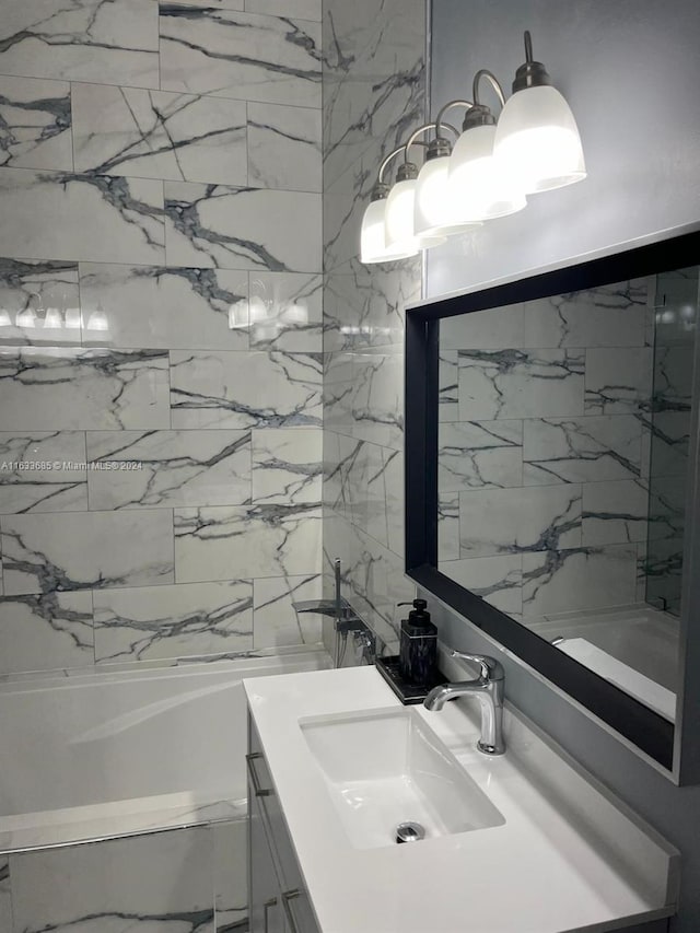 bathroom featuring vanity and a bathing tub