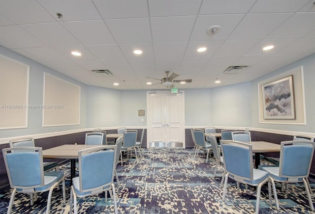 dining area featuring carpet and ceiling fan