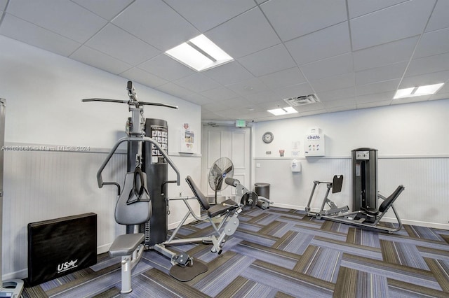 workout area with a drop ceiling