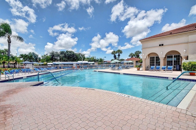 view of swimming pool featuring a patio area