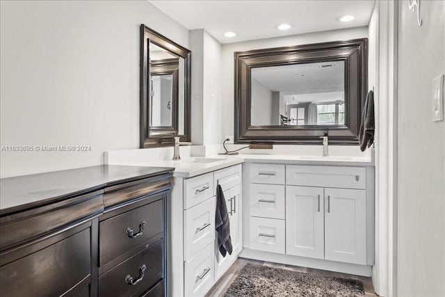 bathroom featuring wood-type flooring and vanity