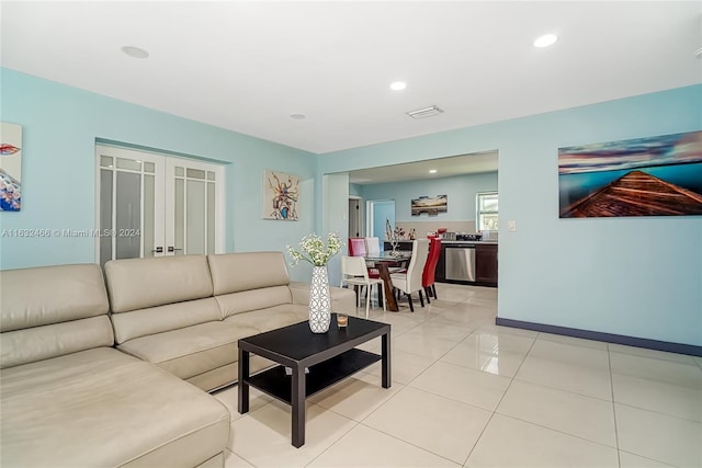 216 SW 6th St, Hallandale Beach, FL 33009 - living room featuring light tile patterned flooring, baseboards, visible vents, and recessed lighting