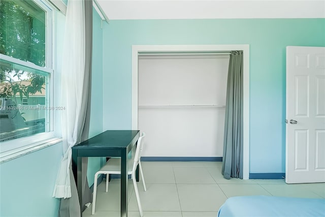 216 SW 6th St, Hallandale Beach, FL 33009 - bedroom featuring baseboards, a closet, and tile patterned flooring