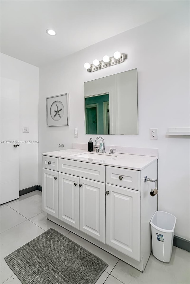 bathroom featuring tile patterned floors and vanity