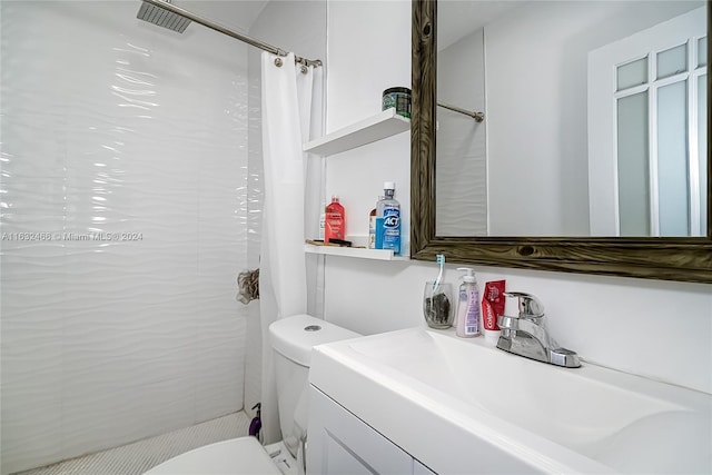 bathroom with toilet and vanity