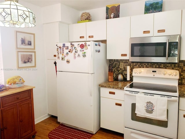 kitchen featuring backsplash, white appliances, light hardwood / wood-style floors, and white cabinets