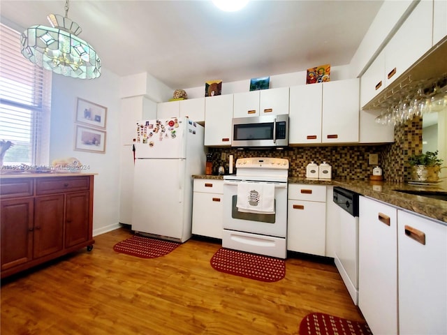 kitchen featuring white cabinetry, light hardwood / wood-style flooring, white appliances, backsplash, and hanging light fixtures