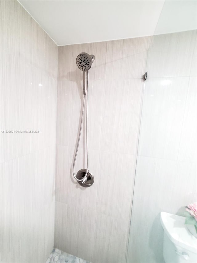 bathroom with tiled shower