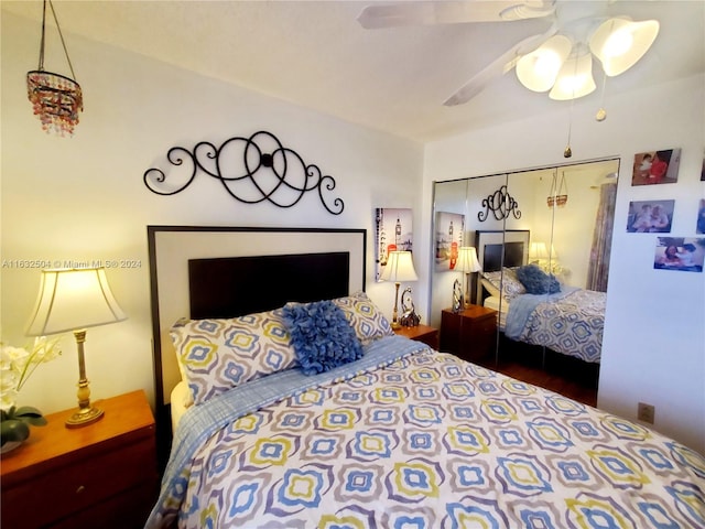 bedroom with ceiling fan, a closet, and wood-type flooring