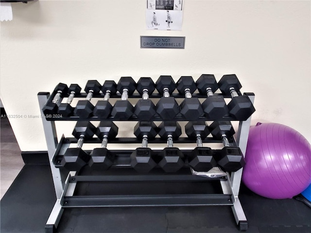 workout area with wood-type flooring