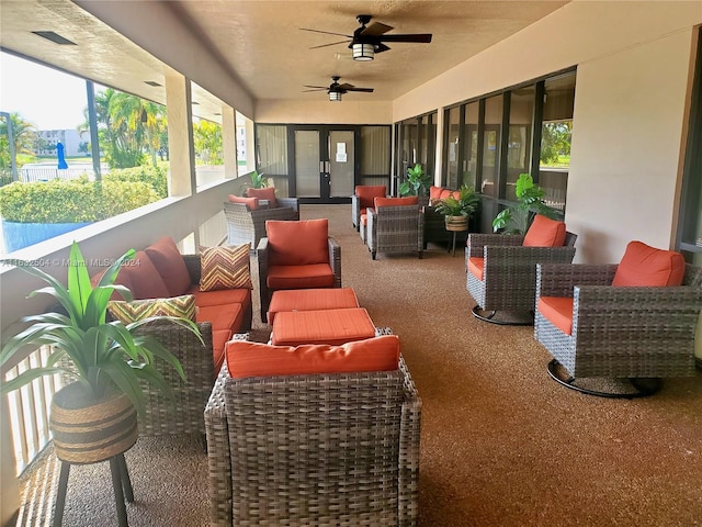 exterior space featuring outdoor lounge area and ceiling fan