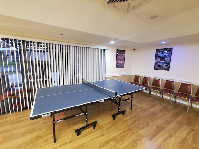 recreation room with light wood-type flooring