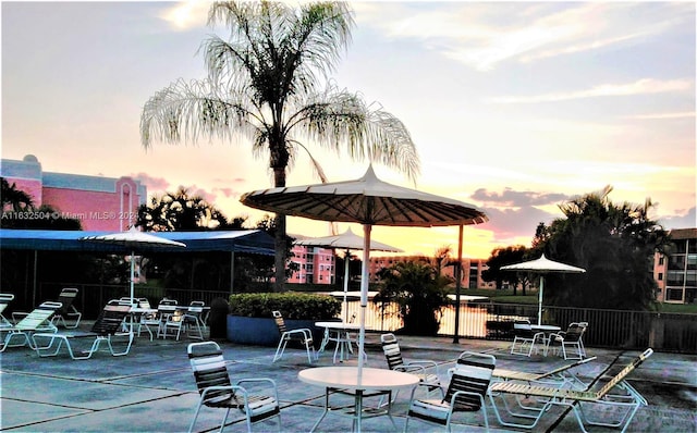 view of patio terrace at dusk