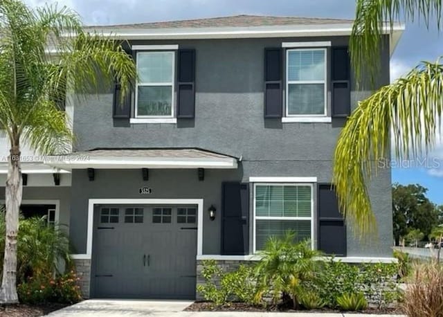 view of front of property with a garage